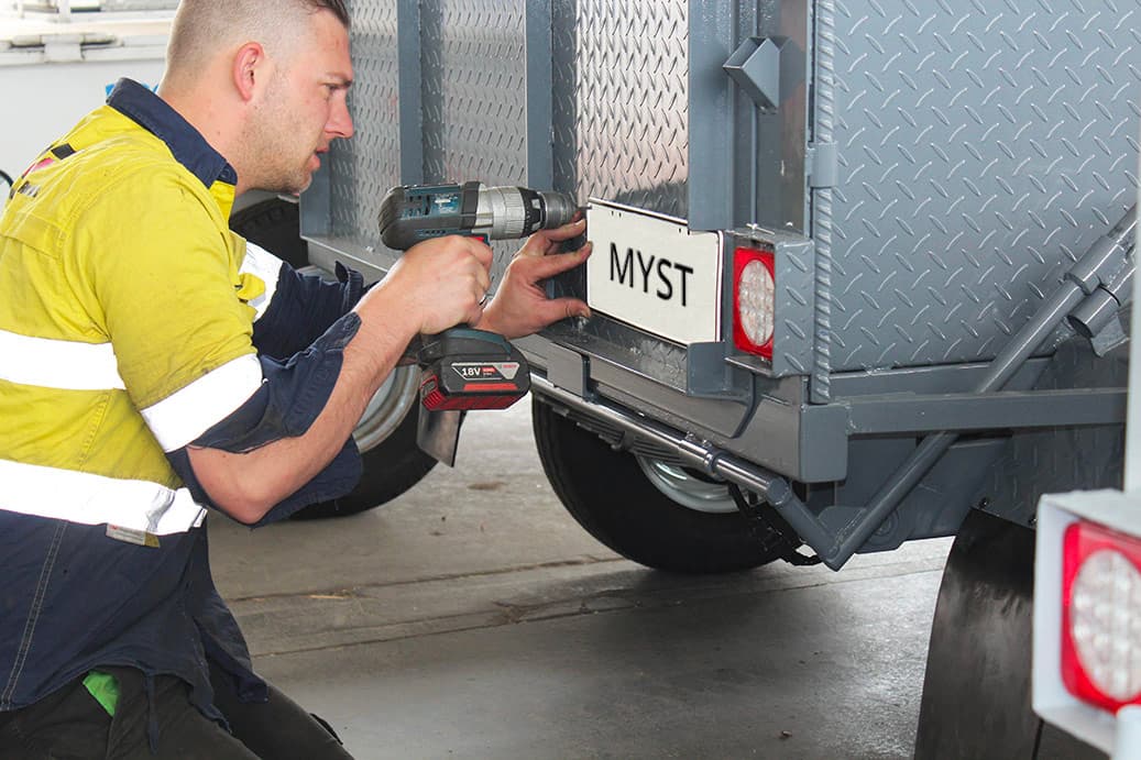 Qualified engineer repairing a trailer